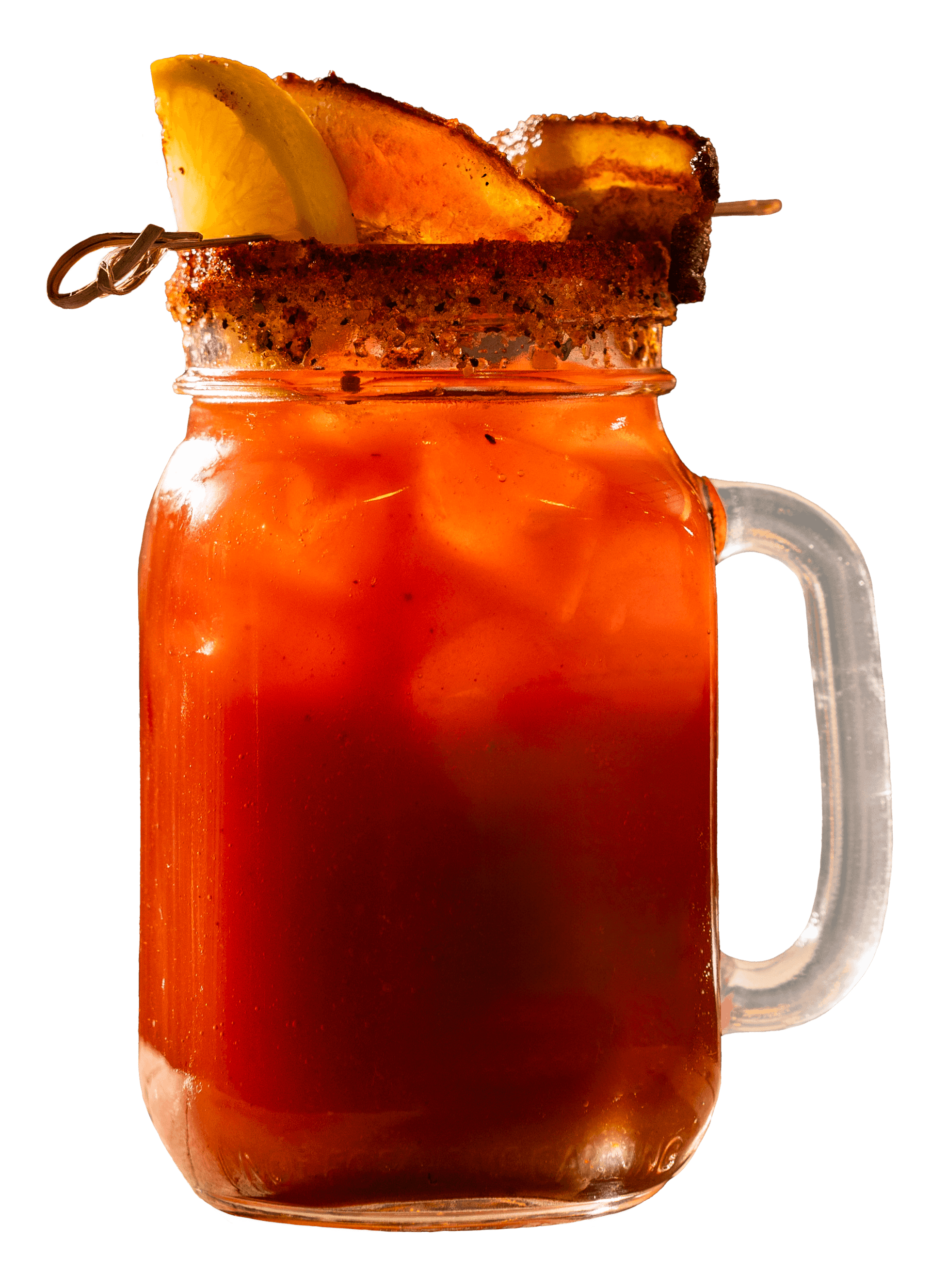 Spiced rimmed glass mug with a red drink, ice, and fruit garnish.